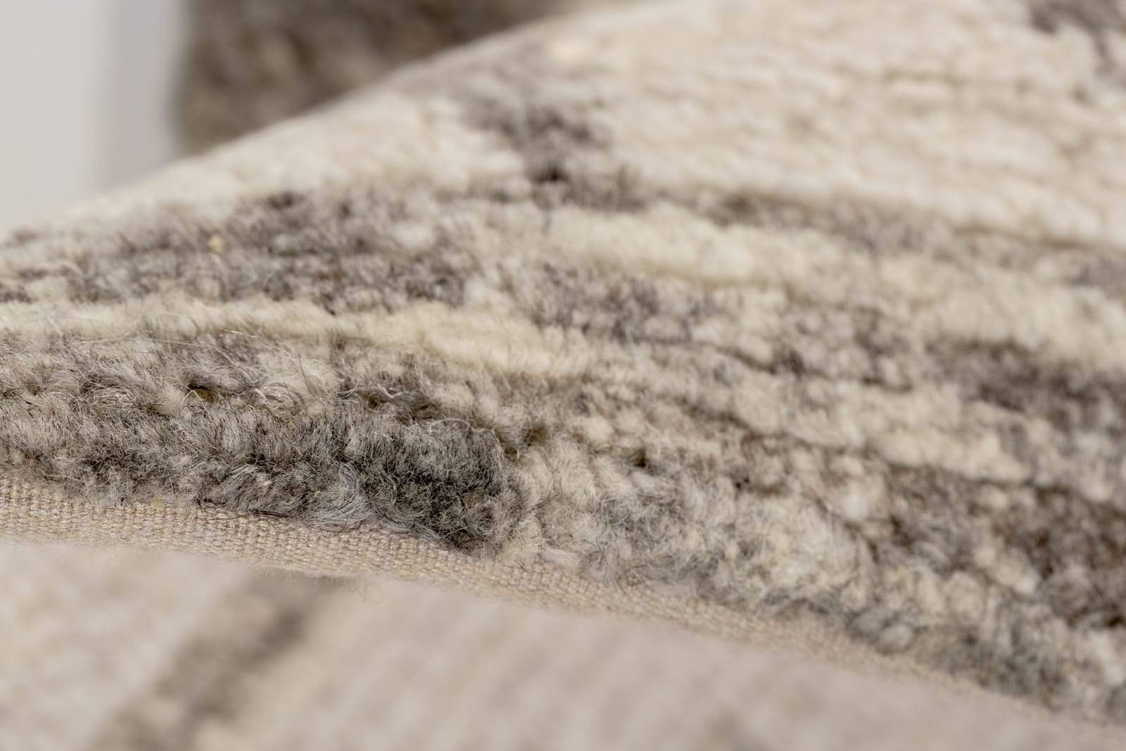 Detail shot of Amaleh II Ivory, a hand knotted rug by Tufenkian Artisan Carpets