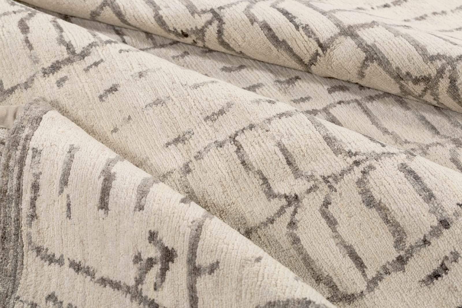 Detail shot of Amaleh II Ivory, a hand knotted rug by Tufenkian Artisan Carpets