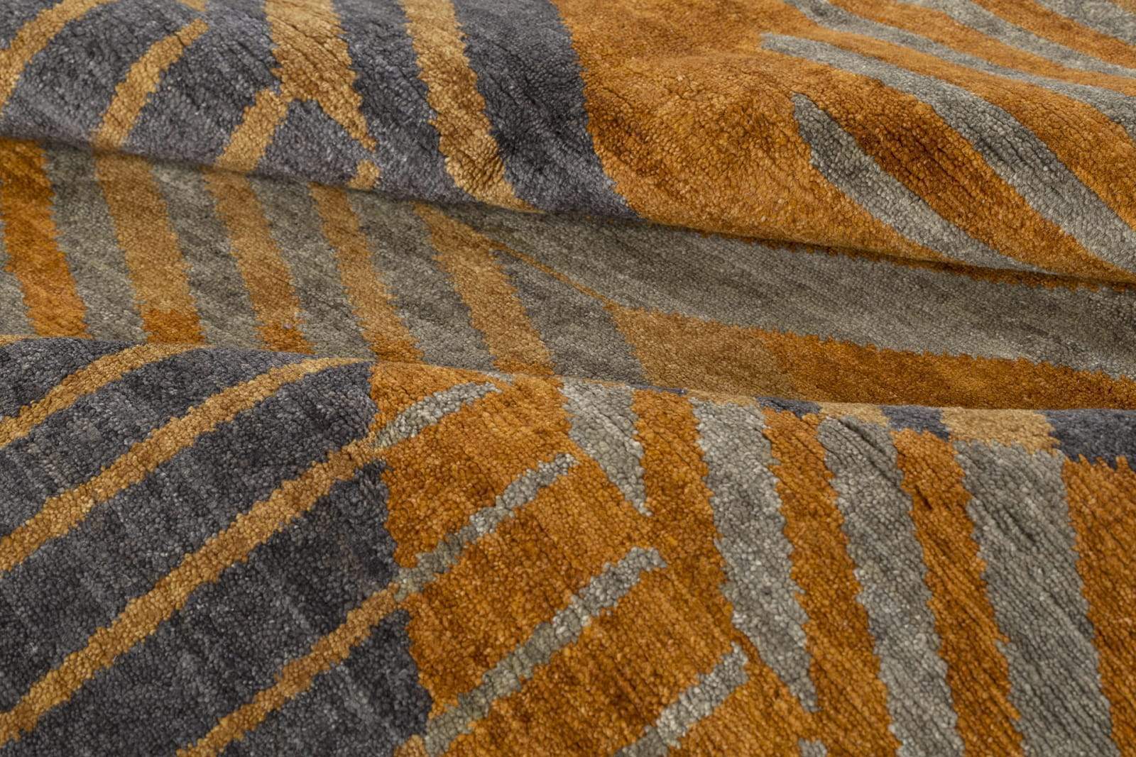 Detail shot of Astrid Amber, a hand knotted rug by Tufenkian Artisan Carpets