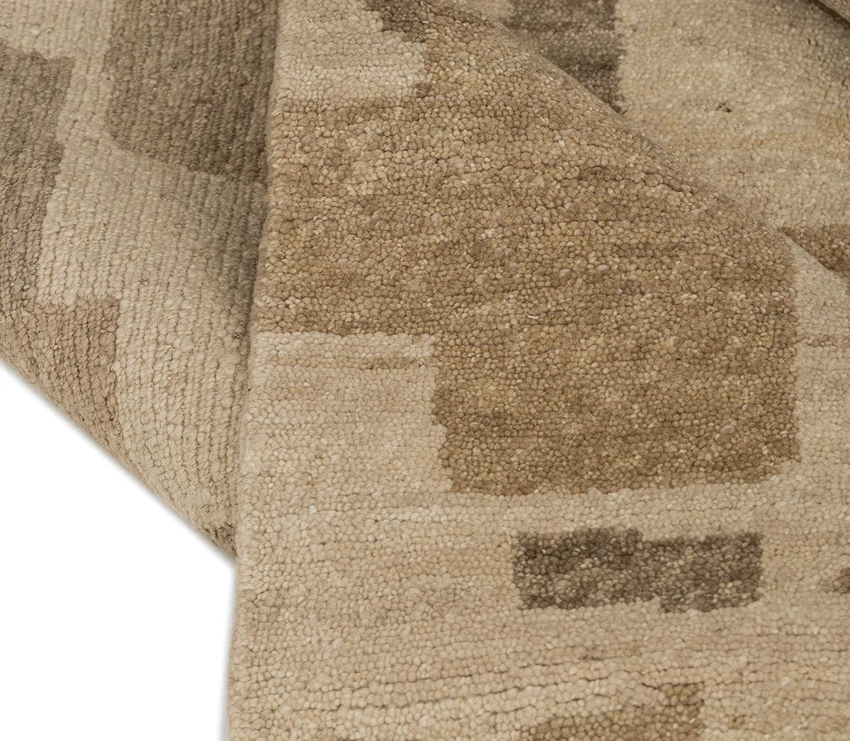 Detail shot of BAKUBA BEIGE, a hand knotted rug designed by Tufenkian Artisan Carpets.