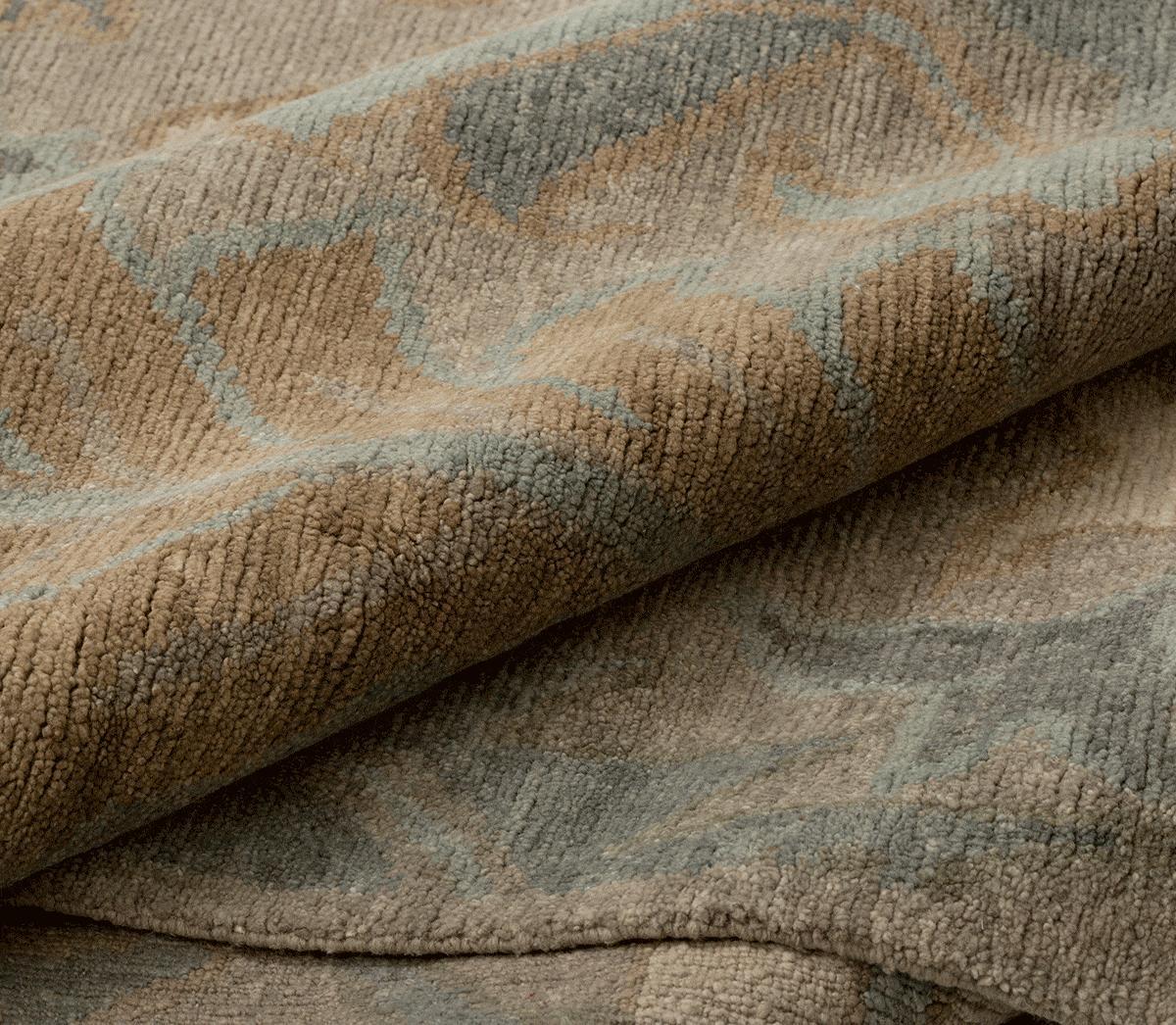 Detail shot of Baneh Taupe, a hand knotted rug designed by Tufenkian Artisan Carpets.