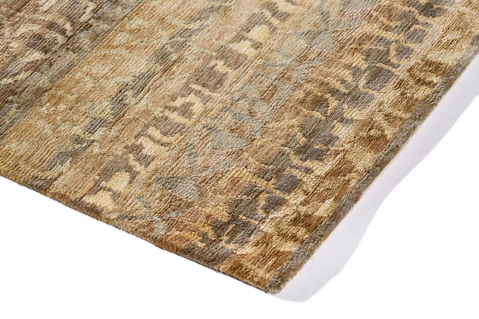 Detail shot of Cuneiform Gold, a hand knotted rug designed by Tufenkian Artisan Carpets.