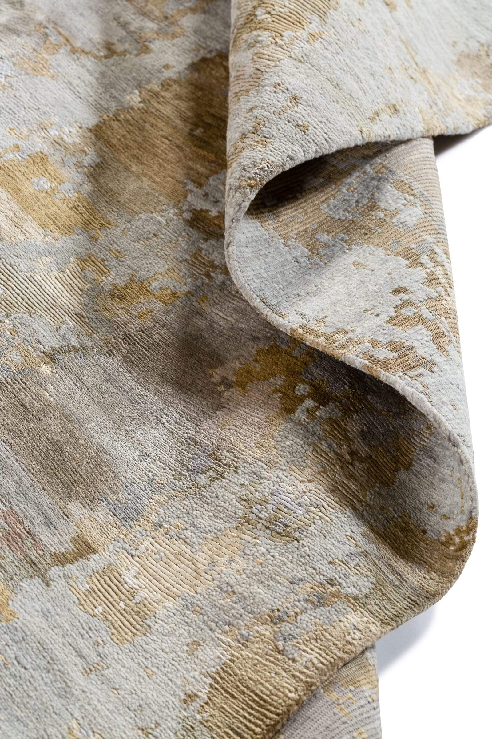 Detail shot of Desert II Grey Gold, a hand knotted rug designed by Tufenkian Artisan Carpets.