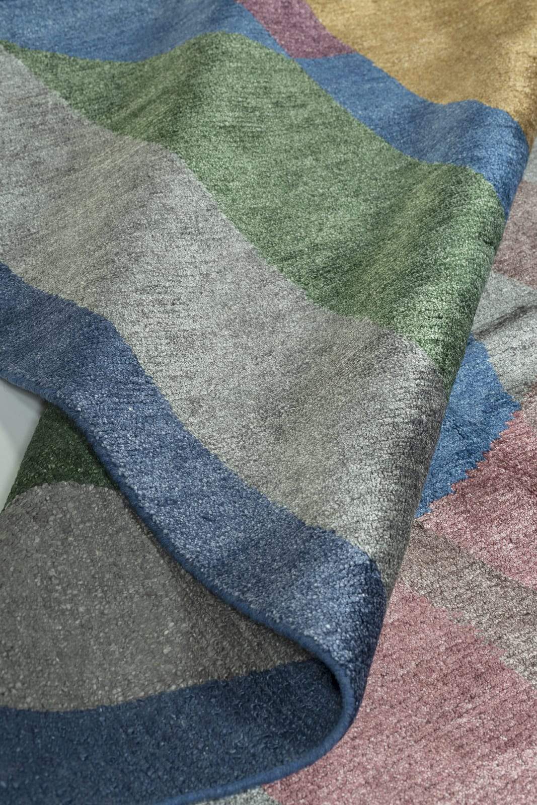 Detail shot of Gilded Cabernet, a hand knotted rug by Tufenkian Artisan Carpets