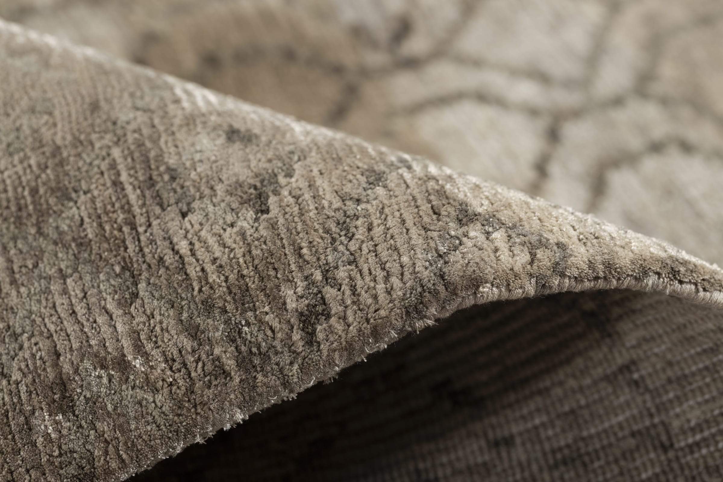 Detail shot of Kikko Taupe, a hand knotted rug designed by Tufenkian Artisan Carpets.