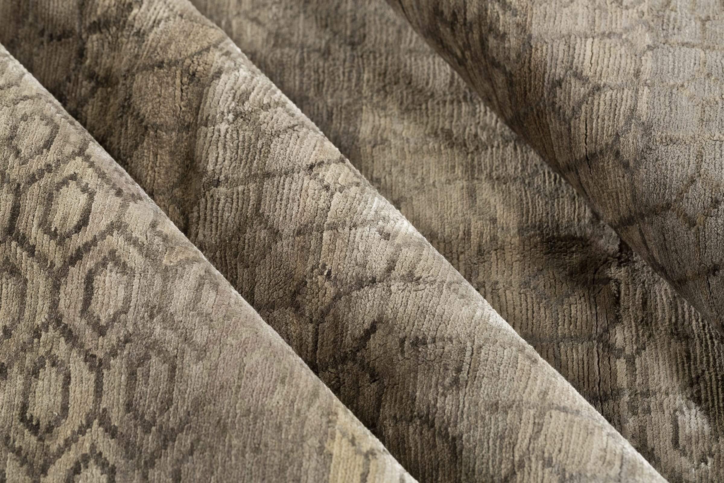 Detail shot of Kikko Taupe, a hand knotted rug designed by Tufenkian Artisan Carpets.