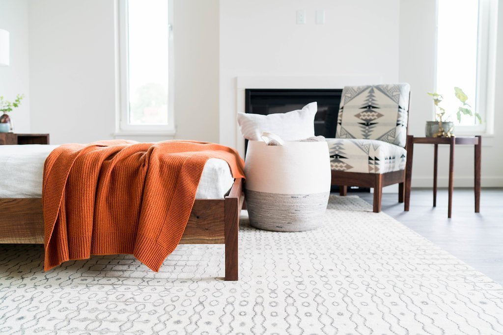 Installation shot of Legato White, a hand knotted rug designed by Tufenkian Artisan Carpets. room-image