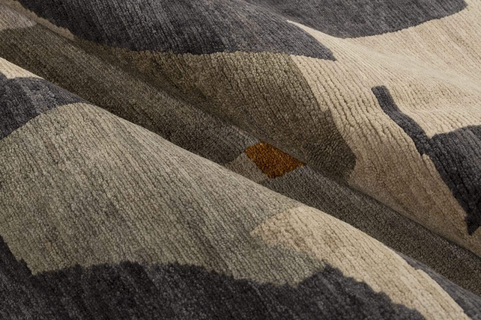 Detail shot of Marlowe II Taupe, a hand knotted rug by Tufenkian Artisan Carpets