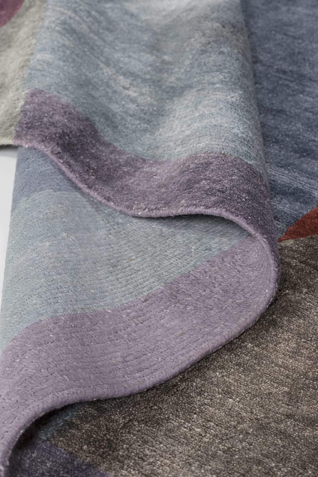 Detail shot of Martine Plum, a hand knotted rug by Tufenkian Artisan Carpets