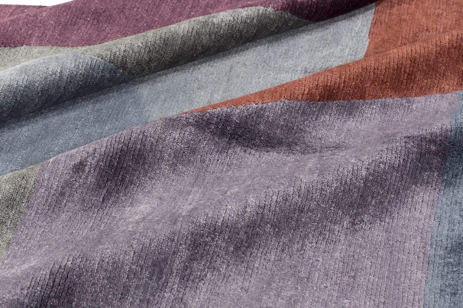 Detail shot of Martine Plum, a hand knotted rug by Tufenkian Artisan Carpets