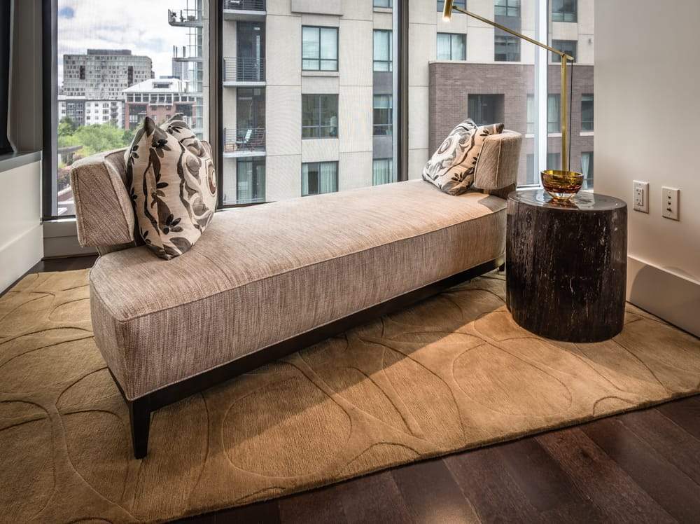 Installation shot of Molecular Loop Oolong, a hand knotted rug designed by Tufenkian Artisan Carpets. room-image