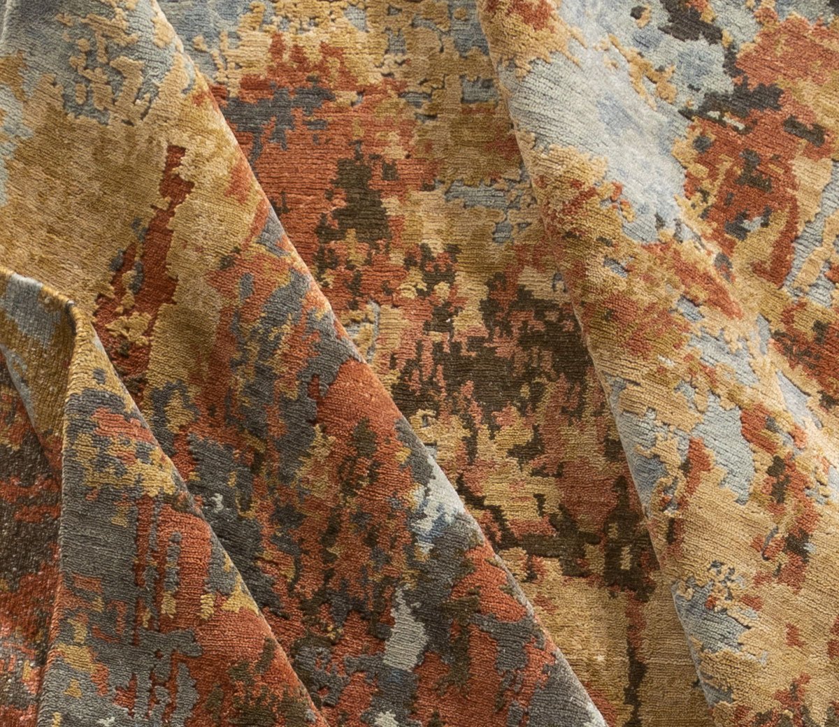 Detail shot of Sgraffito Copper, a hand knotted rug designed by Tufenkian Artisan Carpets.