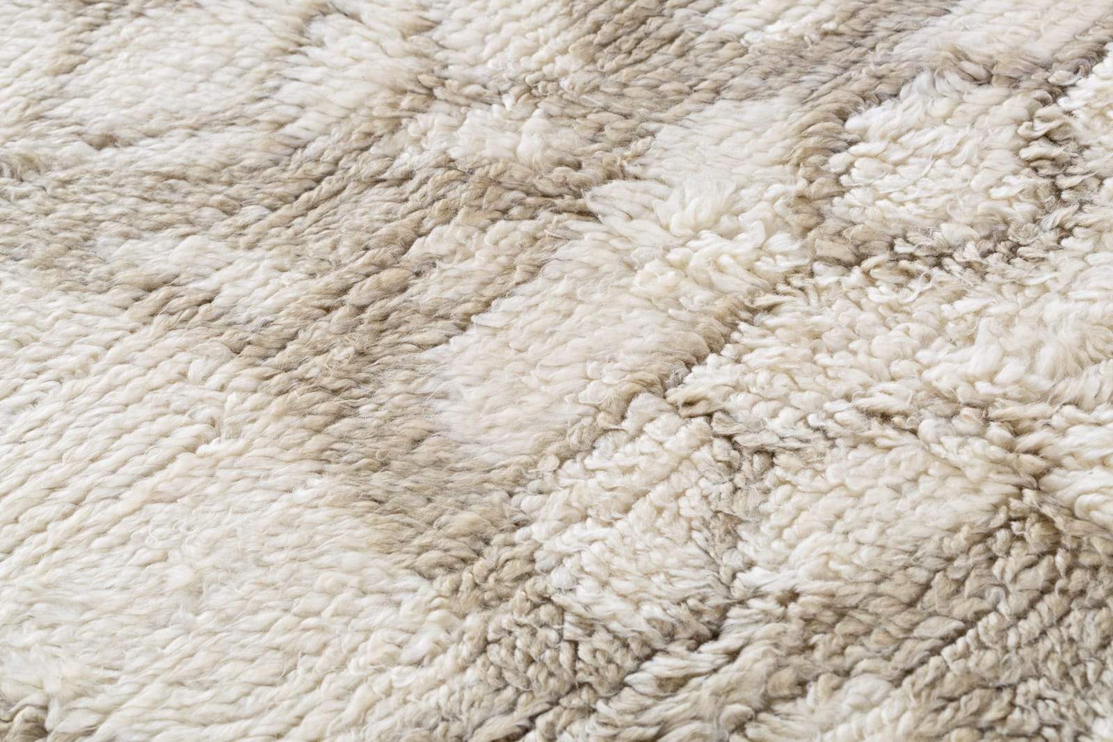 Detail shot of Uroko Tan, a hand knotted rug designed by Tufenkian Artisan Carpets.