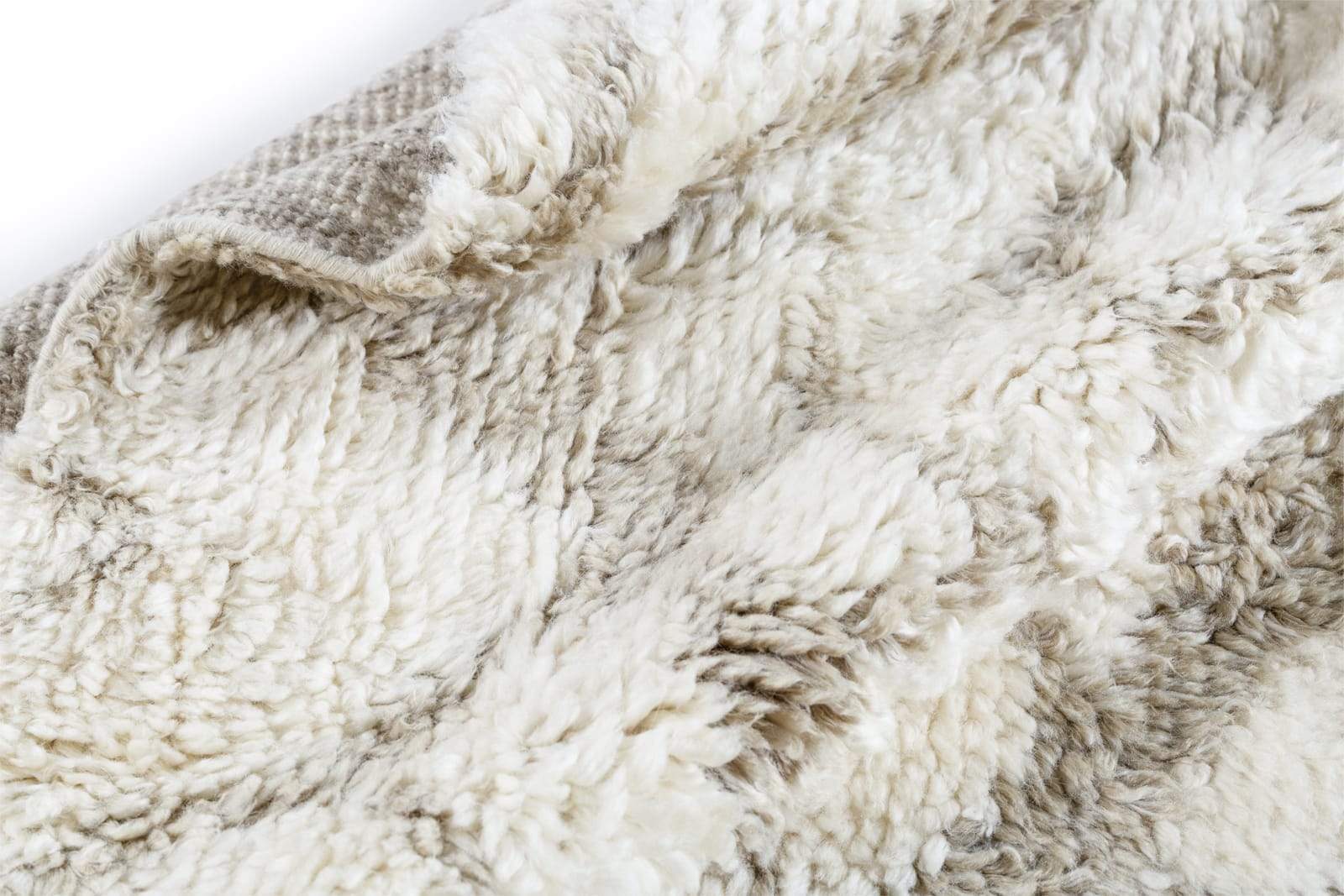 Detail shot of Uroko Tan, a hand knotted rug designed by Tufenkian Artisan Carpets.