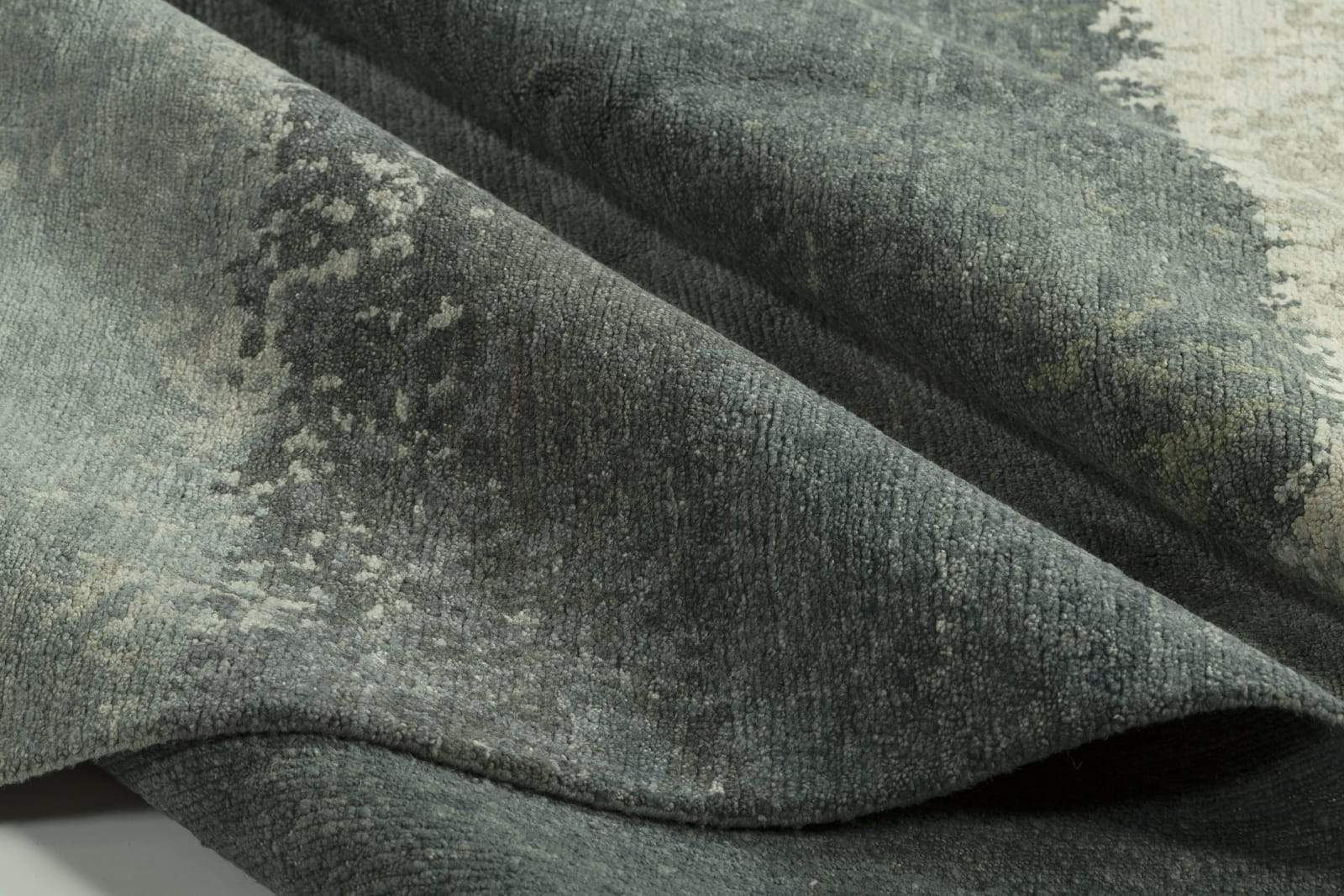 Detail shot of Watercolor Ocean Mist, a hand knotted rug designed by Tufenkian Artisan Carpets.